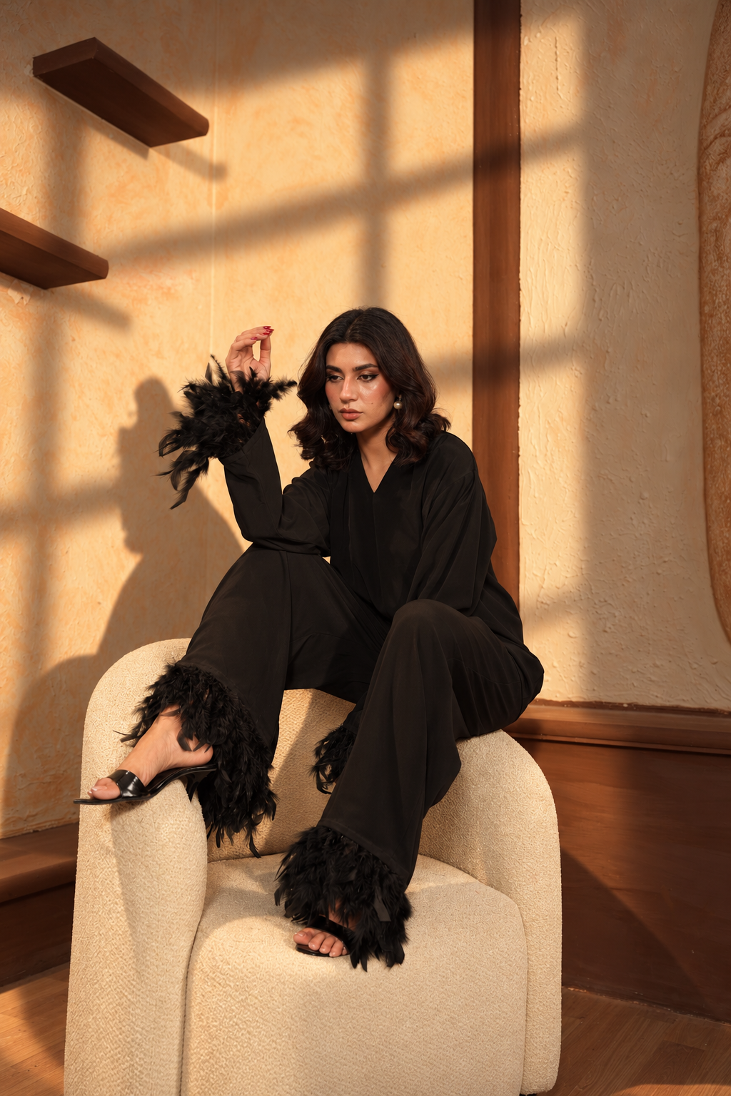 Her Coded Noir edition evening wear in antique gold embroidery
